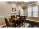 This dining room features a wood table, seating for six, and natural light from the nearby window at 2016 Central Ave, Indianapolis, IN 46202