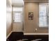 Welcoming entryway with dark hardwood floors, a decorative wall sign, and a bright window with blinds at 2016 Central Ave, Indianapolis, IN 46202
