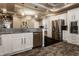 Modern kitchen with stainless steel appliances and eat in bar at 2016 Central Ave, Indianapolis, IN 46202