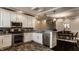 Open kitchen and dining area with granite countertops and stainless steel appliances at 2016 Central Ave, Indianapolis, IN 46202
