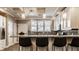 Bright kitchen featuring granite countertops, a breakfast bar, and modern appliances at 2016 Central Ave, Indianapolis, IN 46202