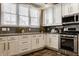 Bright and functional kitchen with white cabinets and modern appliances at 2016 Central Ave, Indianapolis, IN 46202