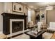 Elegant living room showcases a fireplace, chic seating, a modern coffee table, and refined decorative elements at 2016 Central Ave, Indianapolis, IN 46202