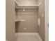 Walk-in closet with built-in shelving and rod, offering ample storage space at 2016 Central Ave, Indianapolis, IN 46202