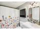 Cozy bathroom with decorative shower curtain, updated vanity, and stylish mirror at 2025 E Broadway St, Fortville, IN 46040
