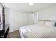 Bright bedroom featuring white walls, laminate floors, and a spacious closet at 2025 E Broadway St, Fortville, IN 46040