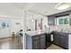 Updated kitchen with grey cabinets, modern appliances, and an open layout for easy entertaining at 2025 E Broadway St, Fortville, IN 46040