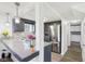 Bright kitchen featuring stainless steel appliances, granite countertops, and decorative backsplash at 2025 E Broadway St, Fortville, IN 46040