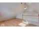Finished attic space with vaulted ceilings, natural light, and wood railing at 2154 Barth Ave, Indianapolis, IN 46203