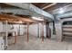 Exposed basement with laundry, utilities, and plenty of room for storage at 2154 Barth Ave, Indianapolis, IN 46203