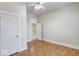 Bedroom featuring a ceiling fan, hardwood floors, and closet at 2154 Barth Ave, Indianapolis, IN 46203