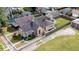 Charming tan house with a fenced yard featuring mature trees and a white picket fence at 2154 Barth Ave, Indianapolis, IN 46203