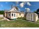 Charming home featuring a shed, lush green lawn, and inviting curb appeal at 2154 Barth Ave, Indianapolis, IN 46203