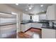 The bright kitchen features stainless steel appliances, sleek counter tops and plenty of cabinet storage at 2154 Barth Ave, Indianapolis, IN 46203