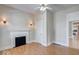 Living room boasts a decorative fireplace, sconce lighting, and hardwood floors at 2154 Barth Ave, Indianapolis, IN 46203