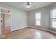 Bright living room with hardwood floors, neutral paint and ample natural light from the many windows at 2154 Barth Ave, Indianapolis, IN 46203