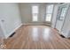 The spacious living room is bright with hardwood floors, and many windows for plenty of natural light at 2154 Barth Ave, Indianapolis, IN 46203
