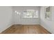 Inviting living room showcasing pristine walls, hardwood floors, and a large window at 2344 N Leland Ave, Indianapolis, IN 46218