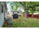 Enjoy this large yard and mature trees along with a storage shed and AC unit at 2726 Dawson St, Indianapolis, IN 46203