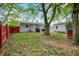 Spacious backyard with ample green space and beautiful landscaping at 2726 Dawson St, Indianapolis, IN 46203