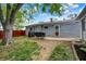This home has a large backyard perfect for entertaining and includes a patio and mature tree at 2726 Dawson St, Indianapolis, IN 46203