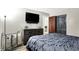Stylish bedroom featuring a dark-wood dresser and large wall-mounted television at 2726 Dawson St, Indianapolis, IN 46203