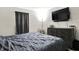 Relaxing bedroom showcasing a gray bed set, sleek dresser, and soft, sheer curtains at 2726 Dawson St, Indianapolis, IN 46203