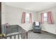 Adorable Bedroom featuring a crib, rocking chair, and soft pink accents, creating a cozy and inviting space for a baby at 2726 Dawson St, Indianapolis, IN 46203