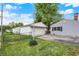 This home has a detached two-car garage and a well-maintained lawn at 2726 Dawson St, Indianapolis, IN 46203