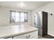 Bright kitchen features a stainless steel refrigerator and white marble countertops, perfect for cooking and entertaining at 2726 Dawson St, Indianapolis, IN 46203