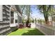 Charming backyard features green lawn, a white picket fence and a beautiful view of the lake at 3602 Bay Rd S Dr, Indianapolis, IN 46240