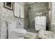 Bathroom with a toilet and glass enclosed shower with white towels hanging at 3602 Bay Rd S Dr, Indianapolis, IN 46240