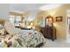 Bright bedroom with a patterned comforter, neutral walls and light-filled window at 3602 Bay Rd S Dr, Indianapolis, IN 46240