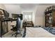 Bedroom featuring a desk area, patterned chair and a large bookshelf at 3602 Bay Rd S Dr, Indianapolis, IN 46240