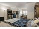 Comfortable bedroom with desk, shelving, and ample space for relaxation or work at 3602 Bay Rd S Dr, Indianapolis, IN 46240
