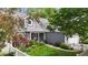 Charming gray home featuring a well-maintained lawn and delightful landscaping at 3602 Bay Rd S Dr, Indianapolis, IN 46240