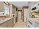 Long and narrow kitchen with stainless appliances, neutral cabinets, and a view to a back door at 3602 Bay Rd S Dr, Indianapolis, IN 46240