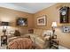 Comfortable living room with L-shaped sofa, side tables, and tasteful wall decor at 3602 Bay Rd S Dr, Indianapolis, IN 46240