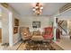 Cozy living room with decorative art, vintage furniture, a decorative rug, and hardwood floors at 3602 Bay Rd S Dr, Indianapolis, IN 46240