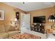 Well-lit living room with a neutral sofa, television and a decorative area rug at 3602 Bay Rd S Dr, Indianapolis, IN 46240