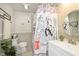 Charming bathroom with a uniquely decorated shower curtain and sleek fixtures at 3723 S Dearborn St, Indianapolis, IN 46237