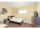 Comfortable bedroom with large window, desk, and natural lighting at 3723 S Dearborn St, Indianapolis, IN 46237