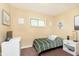 Cozy bedroom featuring a twin bed, neutral walls, and cheerful decor accents at 3723 S Dearborn St, Indianapolis, IN 46237