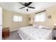 Cozy bedroom with a decorative 'faith' pillow and plenty of natural light from dual windows at 3723 S Dearborn St, Indianapolis, IN 46237