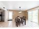 Bright dining area with a modern light fixture and sliding glass door access to outside at 3723 S Dearborn St, Indianapolis, IN 46237
