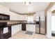 Updated kitchen featuring white cabinets, stainless steel appliances, and tiled floors at 3723 S Dearborn St, Indianapolis, IN 46237