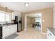 Bright kitchen with stainless steel appliances and tiled flooring that leads to dining at 3723 S Dearborn St, Indianapolis, IN 46237