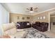 Comfortable living room featuring plush seating, a ceiling fan, and wall decorations at 3723 S Dearborn St, Indianapolis, IN 46237