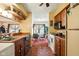 Efficient kitchen with wood cabinets offers easy access to the dining area at 4505 Stratford Dr, Anderson, IN 46013