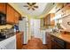 Functional eat-in kitchen featuring wood cabinetry and classic appliances at 4505 Stratford Dr, Anderson, IN 46013